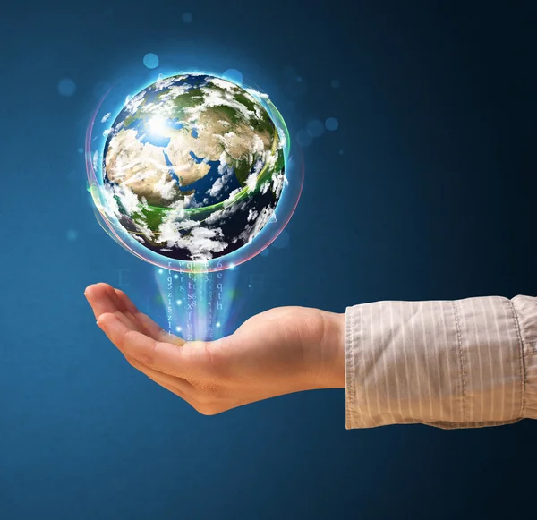 Woman holding a glowing earth globe — Stock Photo, Image