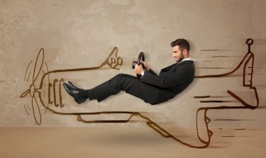 Duvara el çizimi uçak süren komik pilot.