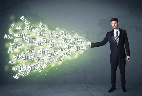 Empresário jogando um monte de conceito de notas de dólar — Fotografia de Stock