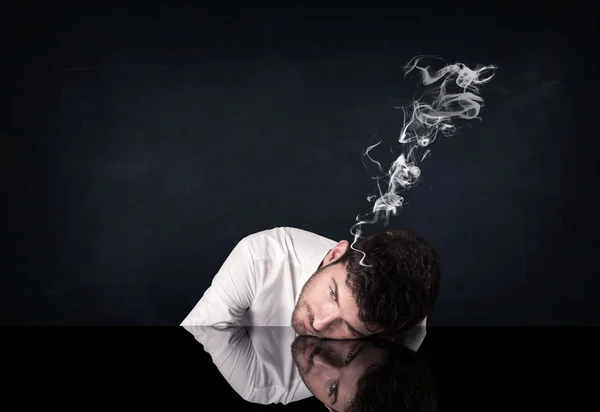 Depressed businessman with smoking head — Stock Photo, Image