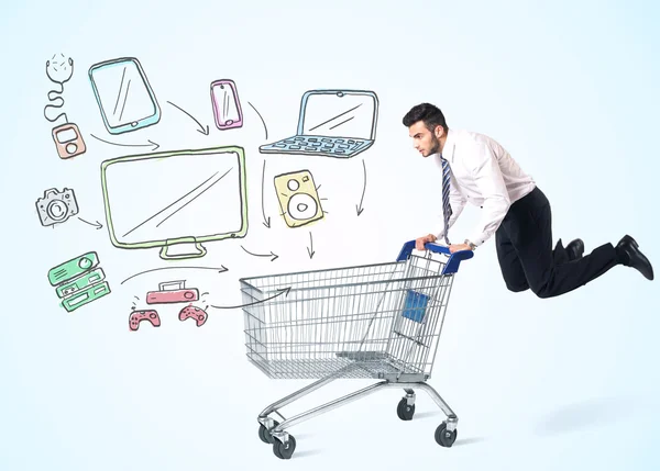 Businessman with shopping cart — Stock Photo, Image