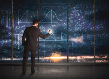 İş adamı iş grafikleri çiziyor