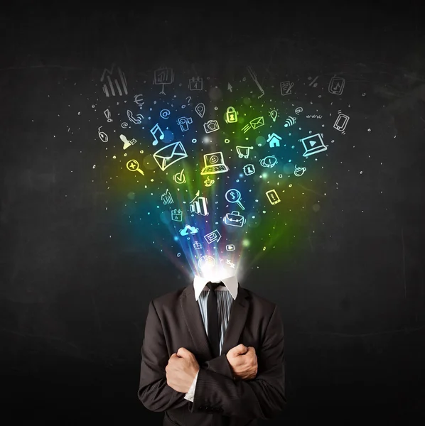 Business man with glowing media icons exploding head — Stock Photo, Image