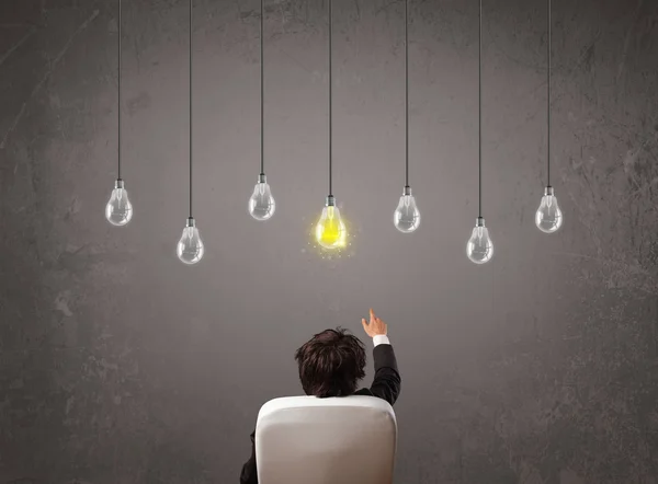 Businness guy in front of idea light bulbs concept — Stock Photo, Image