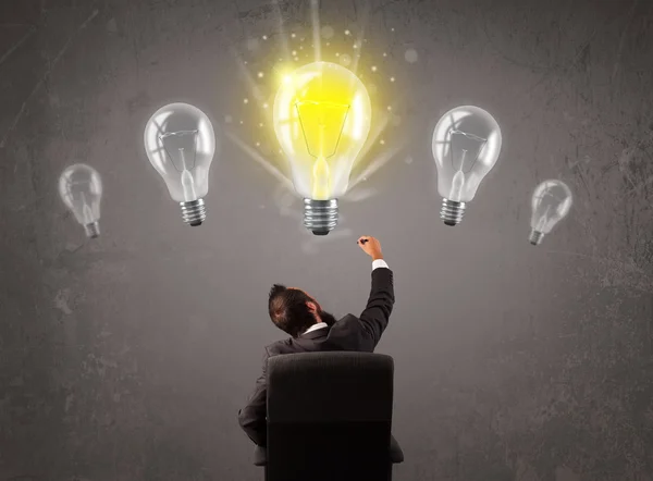 Business person having an idea light bulb concept — Stock Photo, Image