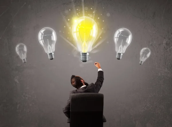 Business person having an idea light bulb concept Royalty Free Stock Images