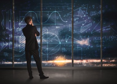 İş adamı iş grafikleri çiziyor