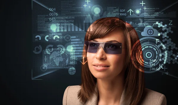 Young woman looking with futuristic smart high tech glasses — Stock Photo, Image