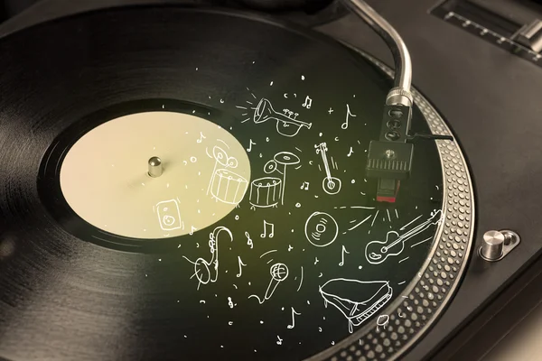 Turntable playing classical music with icon drawn instruments — Stock Photo, Image