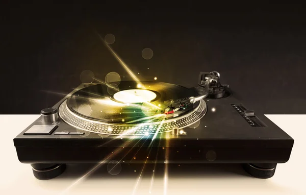 Music player playing vinyl with glow lines comming from the need — Stock Photo, Image
