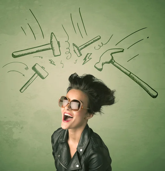 Tired woman with hair style and headache hammer symbols — Stock Photo, Image