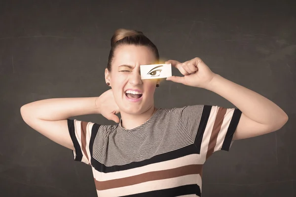 Cool jong op zoek met een papieren hand getrokken ogen — Stockfoto