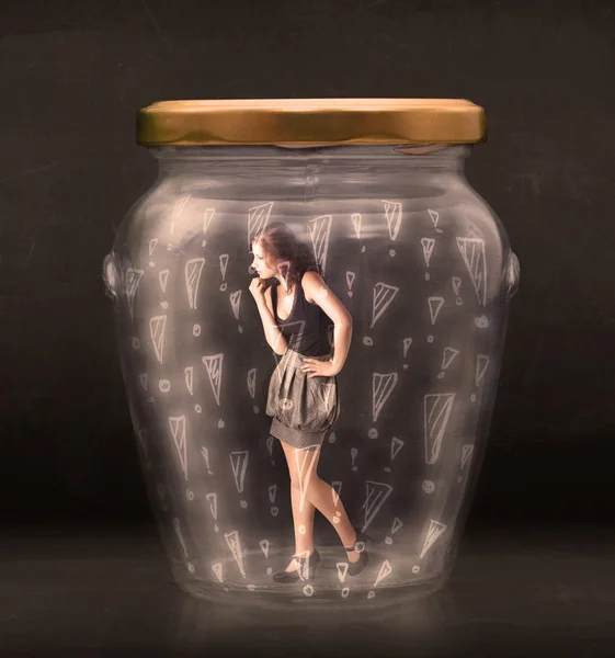 Business woman trapped in jar with exclamation marks concept — Stock Photo, Image