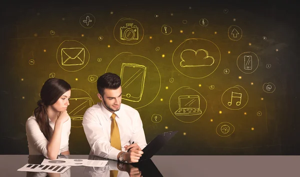 Business couple with media icons background — Stock Photo, Image