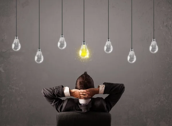 Businness guy in front of idea light bulbs concept — Stock Photo, Image