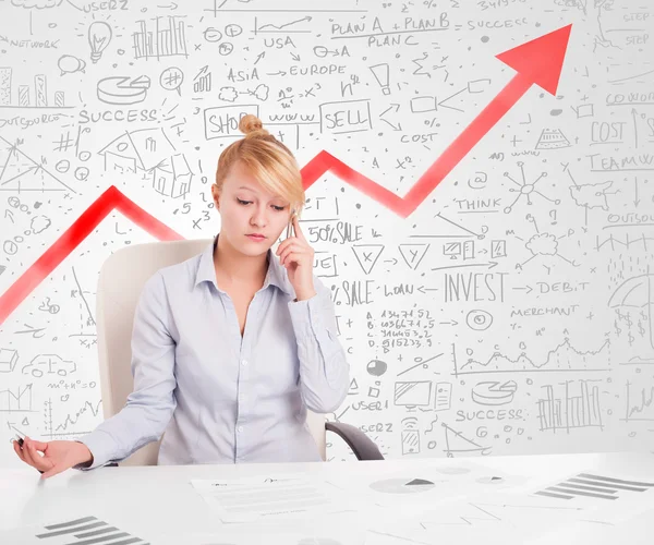 Business woman sitting at table with market diagrams — Stock Photo, Image