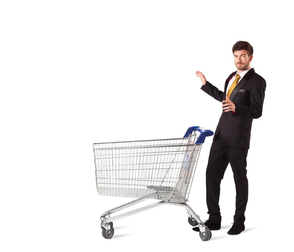 Businessman with shopping cart — Stock Photo, Image