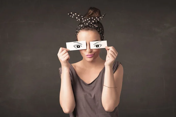 Silly youngster looking with hand drawn eye paper — Stock Photo, Image