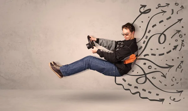 Funny man driving a flying vehicle with hand drawn lines after h — Stock Photo, Image