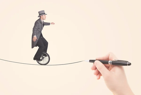 Affärsman ridning monocycle på ett rep ritat för hand — Stockfoto