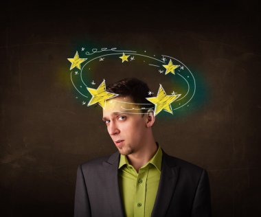 Young man with yellow stars circleing around his head clipart