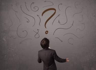 İş adamı soru işareti skecine bakıyor.