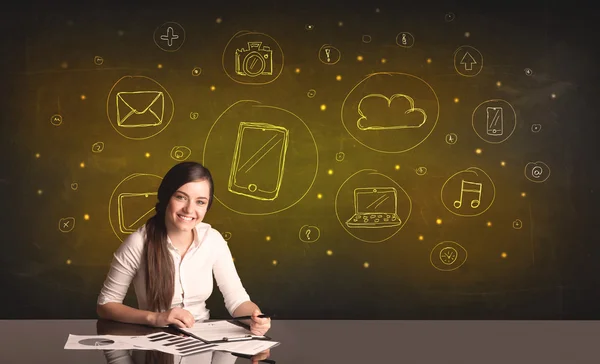 Businesswoman with all kind of hand-drawn media icons — Stock Photo, Image