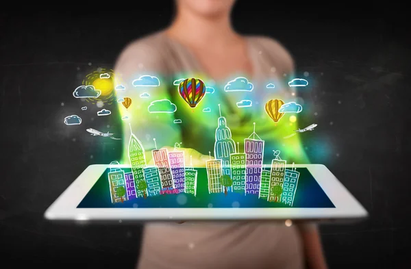 Young person showing tablet with hand drawn cityscape — Stock Photo, Image