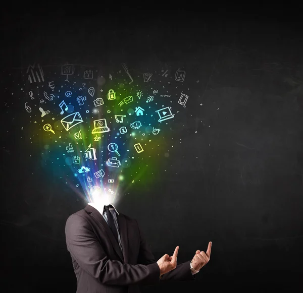 Business man with glowing media icons exploding head — Stock Photo, Image