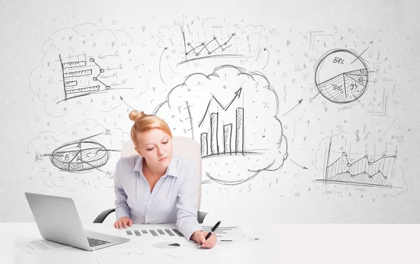 Business woman sitting at table with hand drawn graph charts — Stock Photo, Image