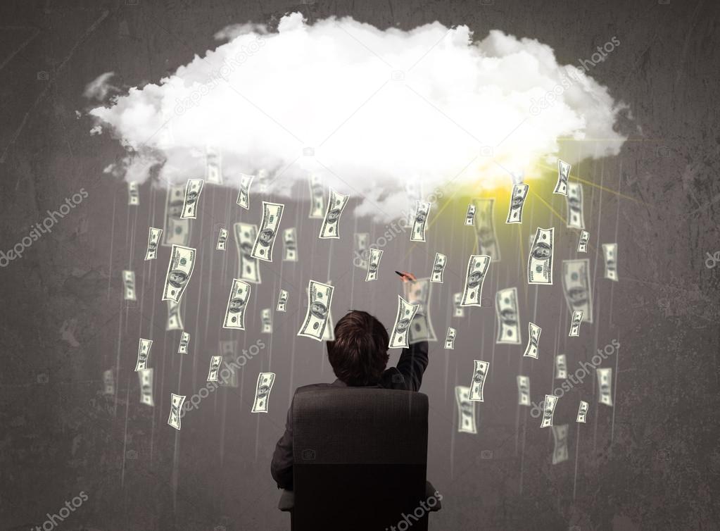 Business man in suit looking at cloud with falling money