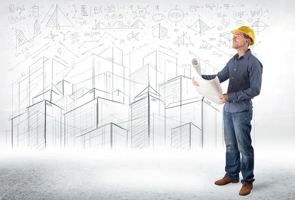 Handsome construction specialist with city drawing in background — Stock Photo, Image