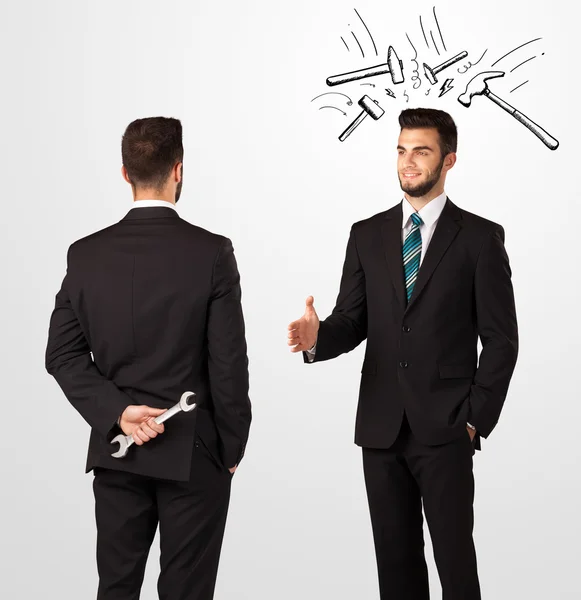 Businessman hiding a weapon — Stock Photo, Image