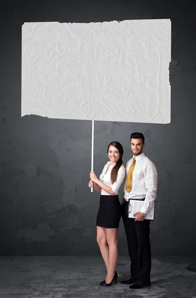 Business couple with blank booklet paper — Stock Photo, Image