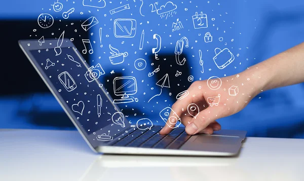 Laptop computer wtih hand drawn icons and symbols — Stock Photo, Image