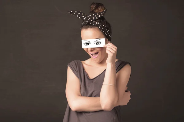 Silly youngster looking with hand drawn eye paper — Stock Photo, Image