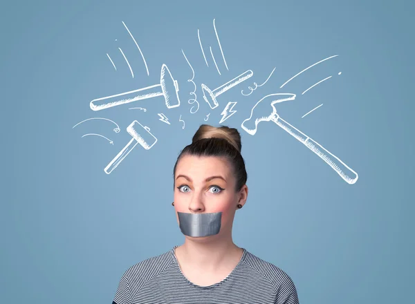 Young woman with glued mouth and hammer marks — Stock Photo, Image