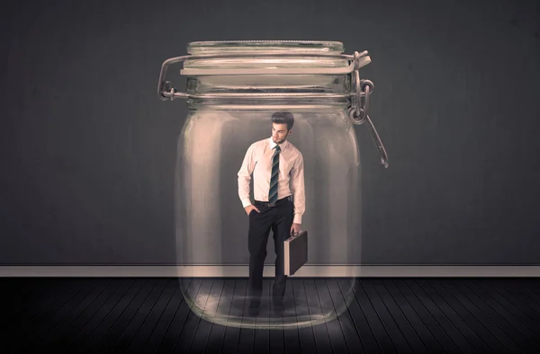 Businessman trapped into a glass jar concept — Stock Photo, Image