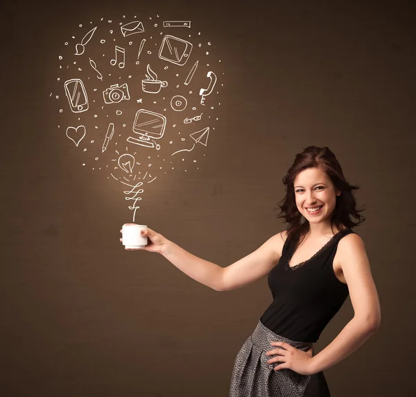 Businesswoman holding a white cup with social media icons — Stock Photo, Image