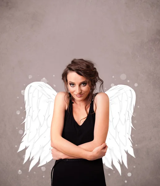 Person with angel illustrated wings on grungy background — Stock Photo, Image