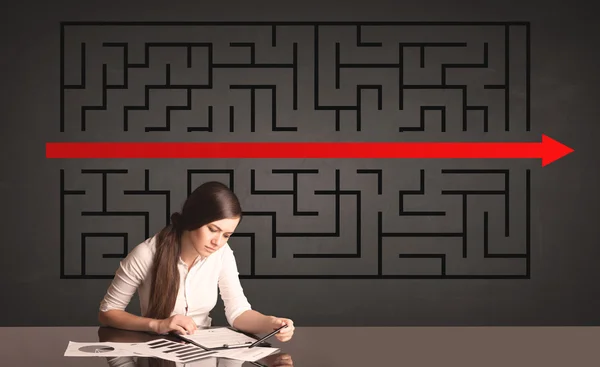 Businesswoman with a solved puzzle in background — Stock Photo, Image