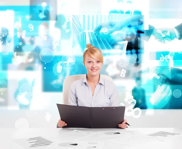 Business person at desk with modern tech images at background — Stock Photo, Image