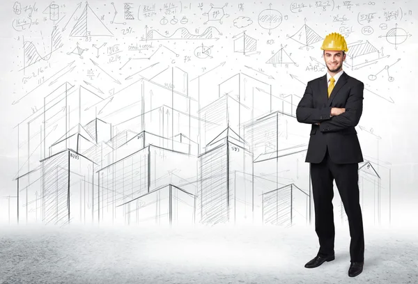 Handsome construction specialist with city drawing in background — Stock Photo, Image