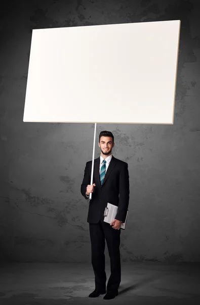 Businessman with blank whiteboard — Stock Photo, Image