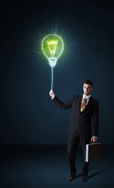 Empresário com uma lâmpada ideia — Fotografia de Stock