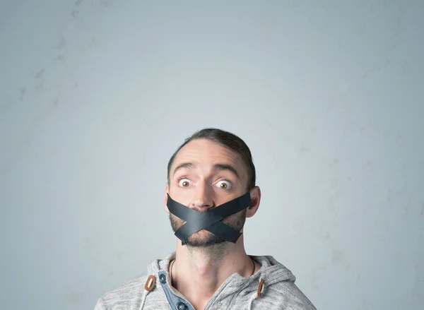 Young man with glued mouth — Stock Photo, Image