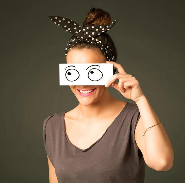 Young silly girl looking with hand drawn eye balls on paper — Stock Photo, Image