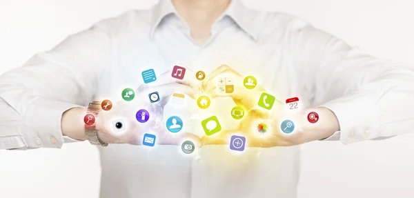 Hands creating a form with mobile app icons — Stock Photo, Image