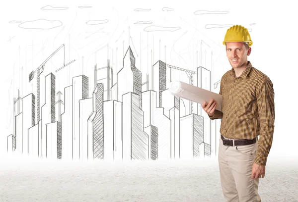 Engineer man with building city drawing in background — Stock Photo, Image