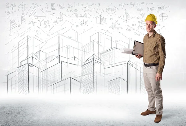 Handsome construction specialist with city drawing in background — Stock Photo, Image